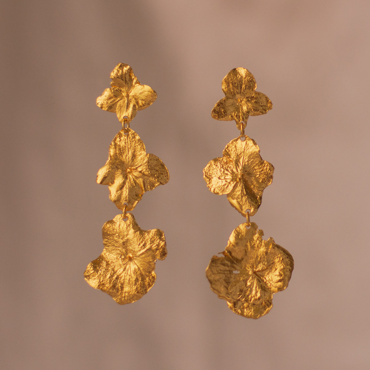 Three Hydrangea Flower Earrings, handcrafted in bronze with 24k gold plating, featuring delicate hydrangea petals for a natural and elegant look.