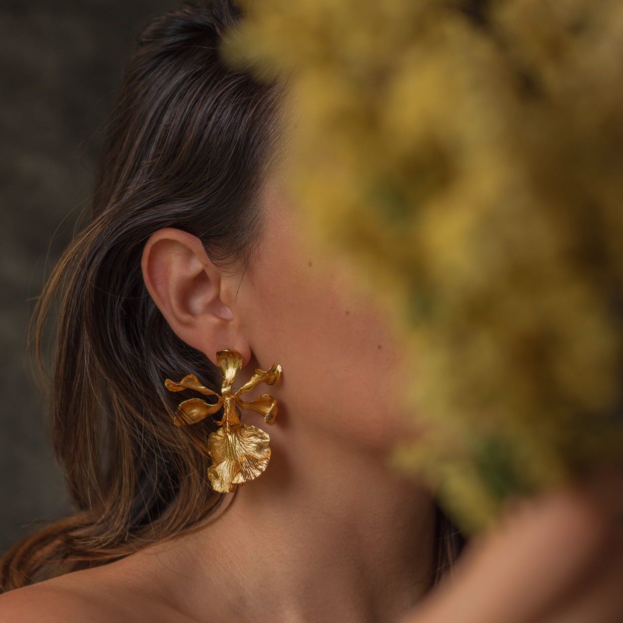 Model wearing Encyclia Cordigera Orchid Earrings, demonstrating the elegant and exotic look of these unique earrings.