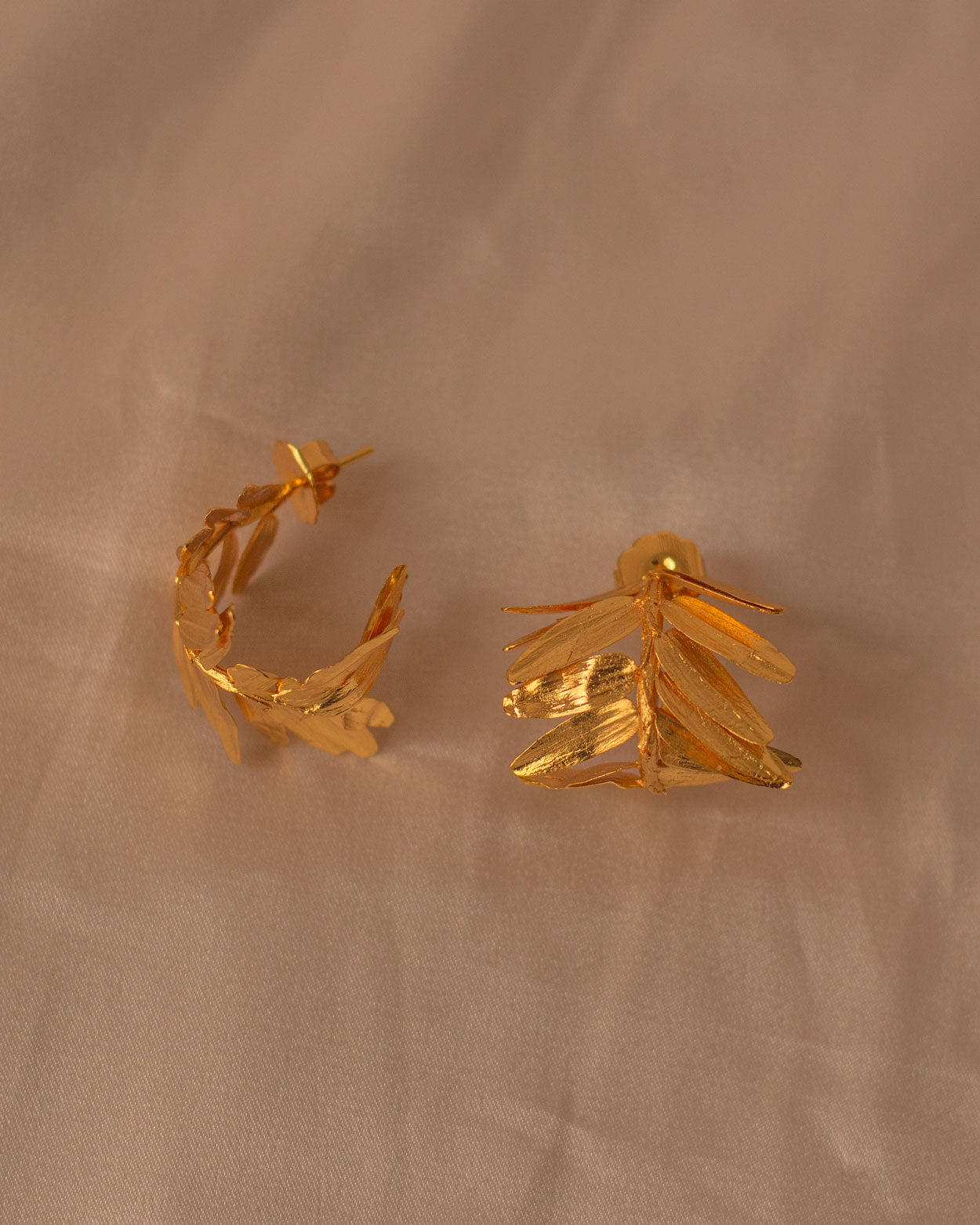 Nature-inspired Romeron Fern Hoop Earrings with organic casting and 24k gold finish.