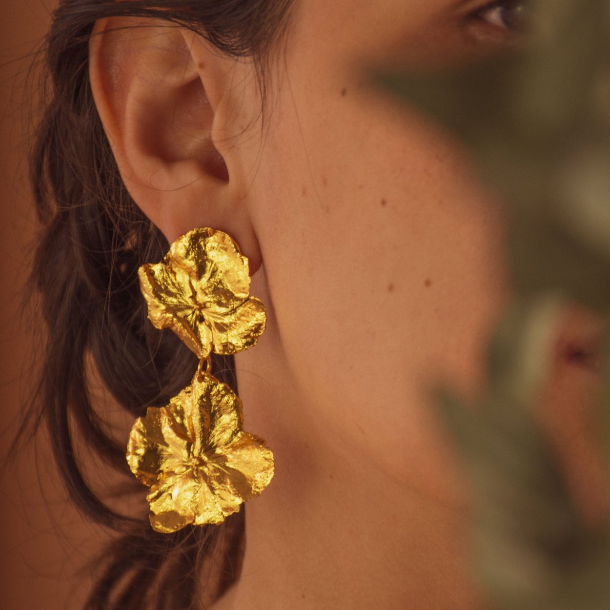 Model wearing Two Hydrangea Earrings, highlighting the natural beauty and unique design.