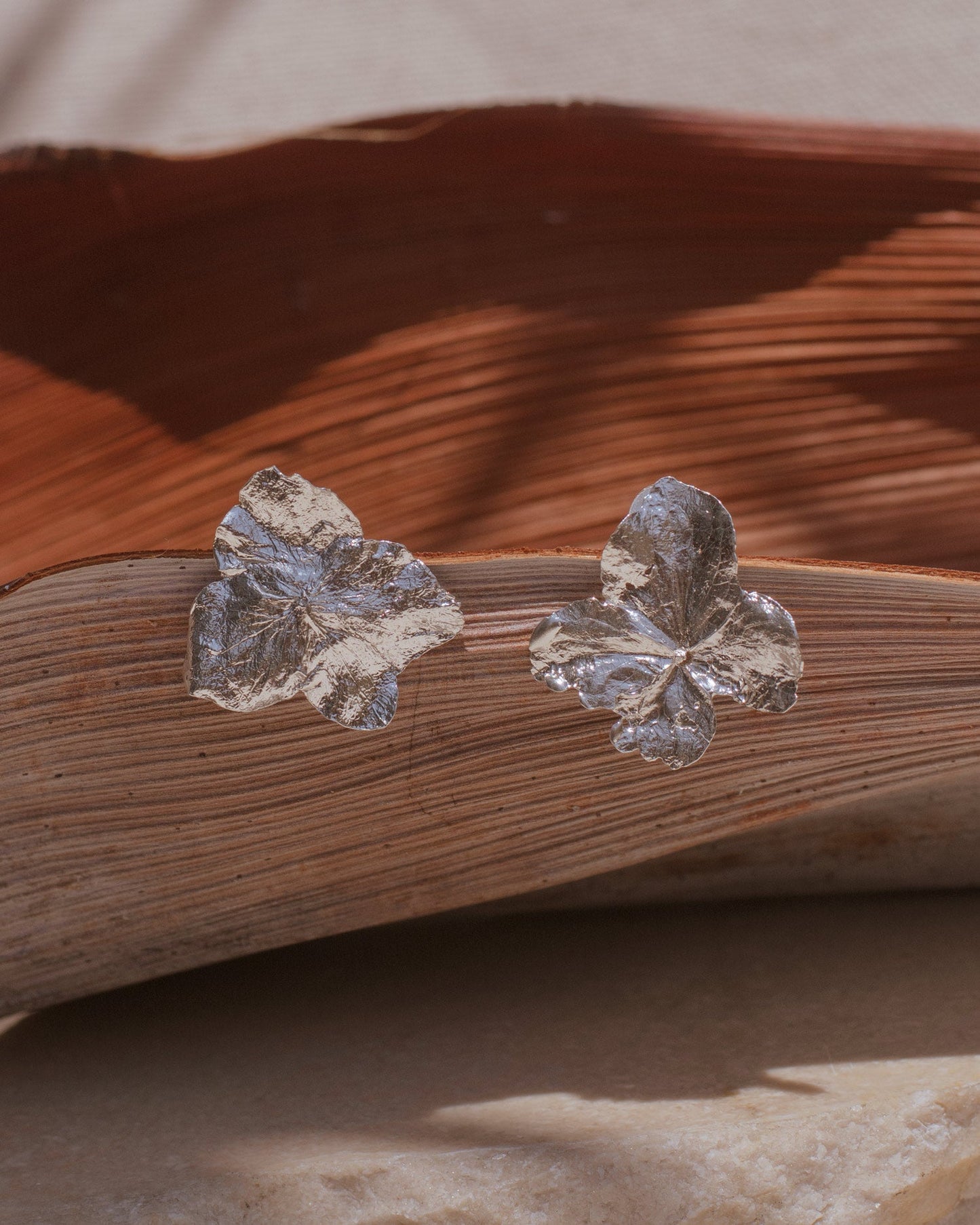 Unique Eco-Friendly Silver Hydrangea Stud Earrings, capturing the delicate beauty and intricate story of each hydrangea