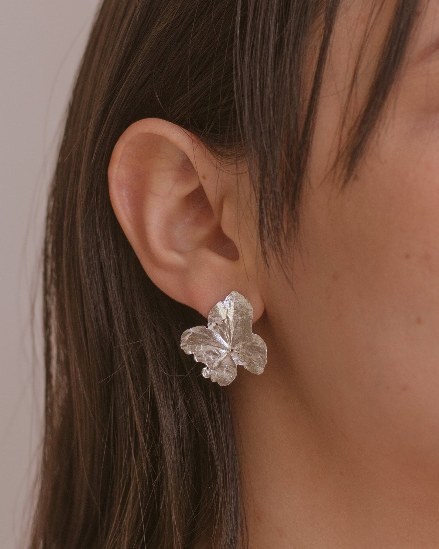 Unique Eco-Friendly Silver Hydrangea Stud Earrings, capturing the delicate beauty and intricate story of each hydrangea