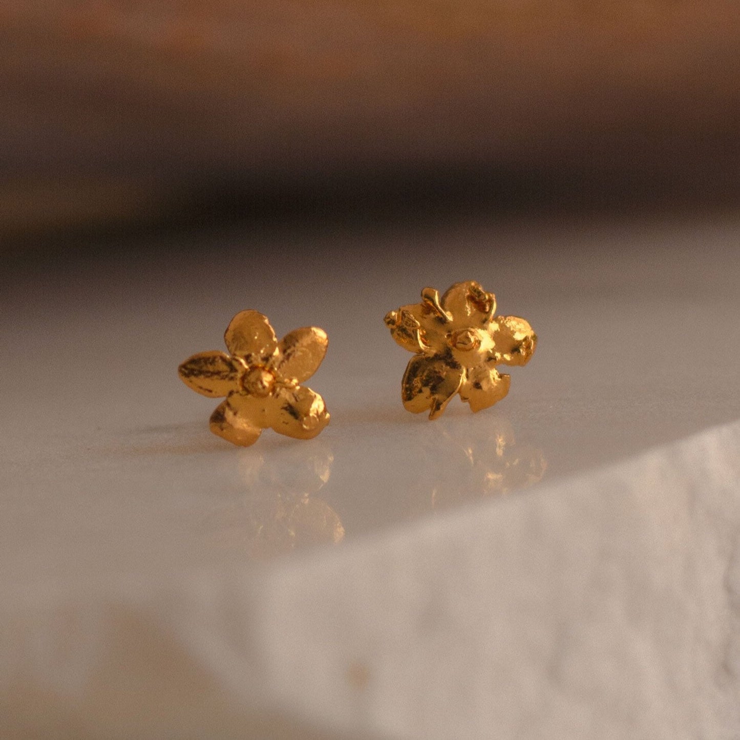 Elegant Mini Elderflower Stud Earrings in 24K gold plating, capturing the delicate essence of nature in a luxurious accessory