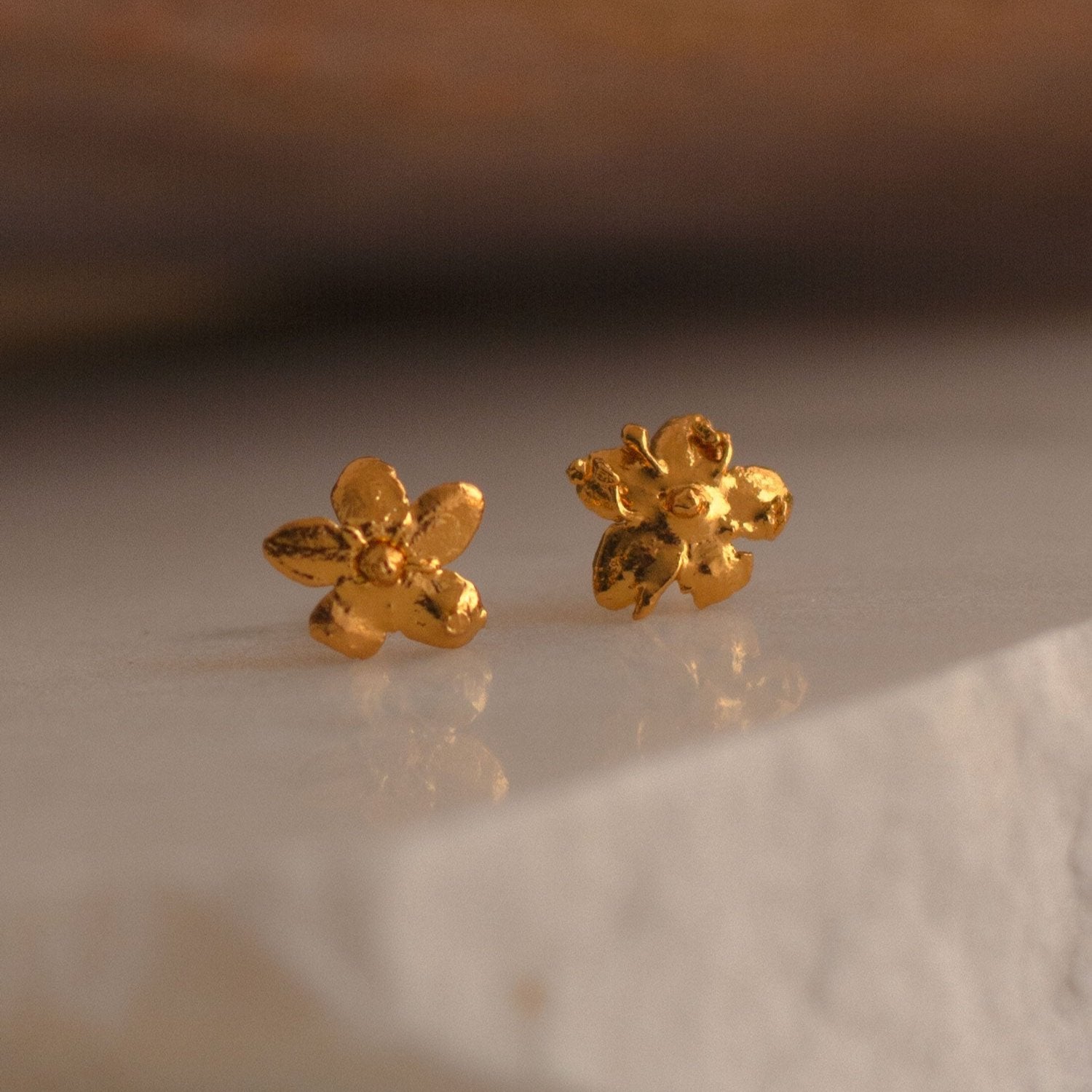 Elegant Mini Elderflower Stud Earrings in 24K gold plating, capturing the delicate essence of nature in a luxurious accessory