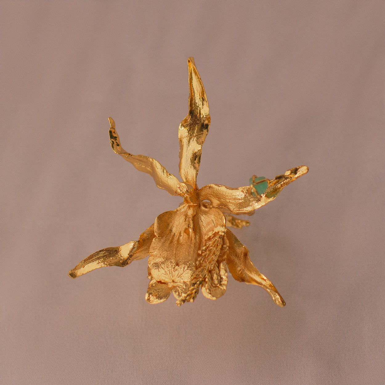 Brassia Orchid Emerald Ring crafted with organic casting in bronze and 24k gold plating, adorned with Colombian raw emeralds