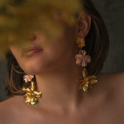 Detailed view of handcrafted Odontoglossum Orchid Ivy Leaf Emerald Earrings, featuring organic shapes and Colombian emerald accents