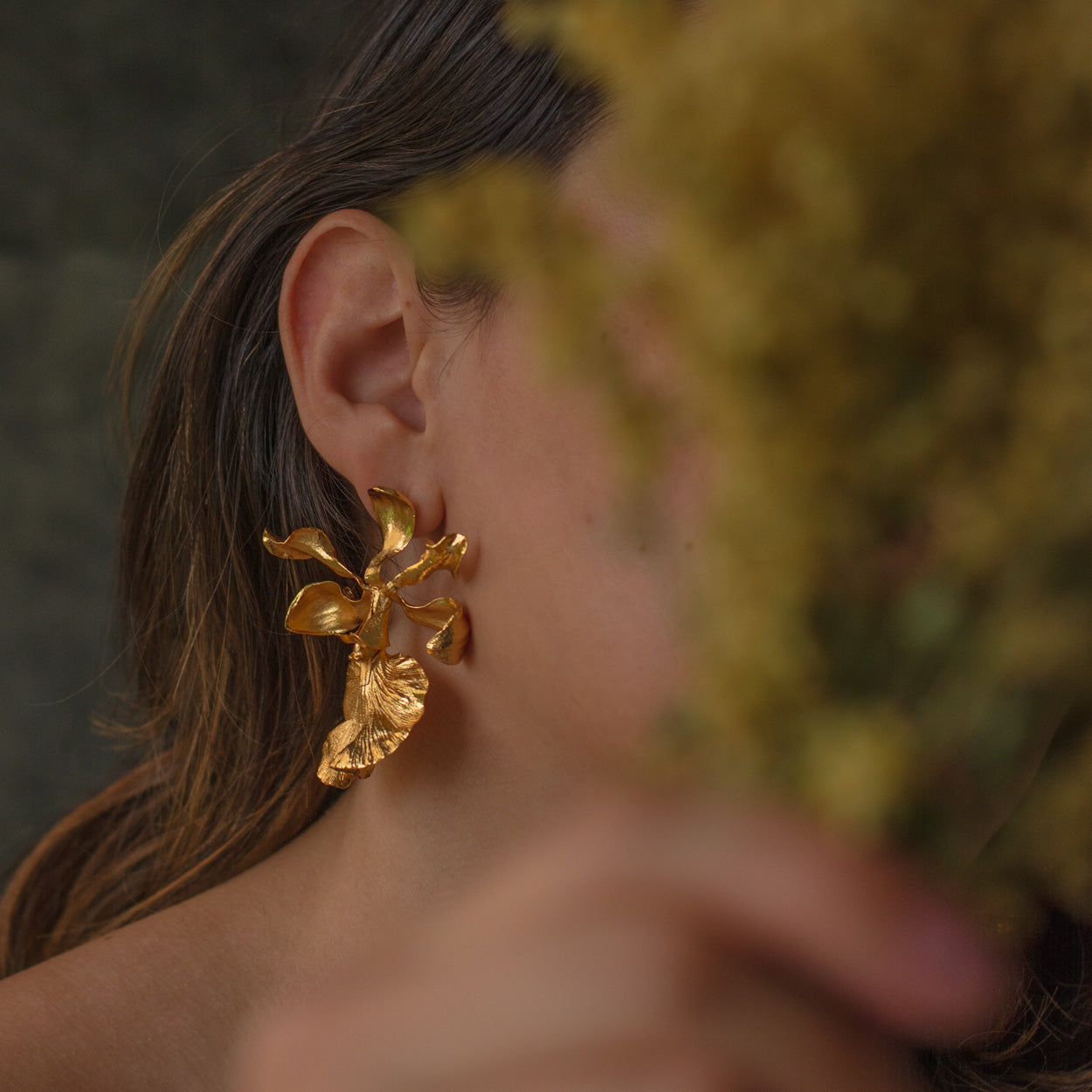 Model wearing Encyclia Cordigera Orchid Earrings, demonstrating the elegant and exotic look of these unique earrings.
