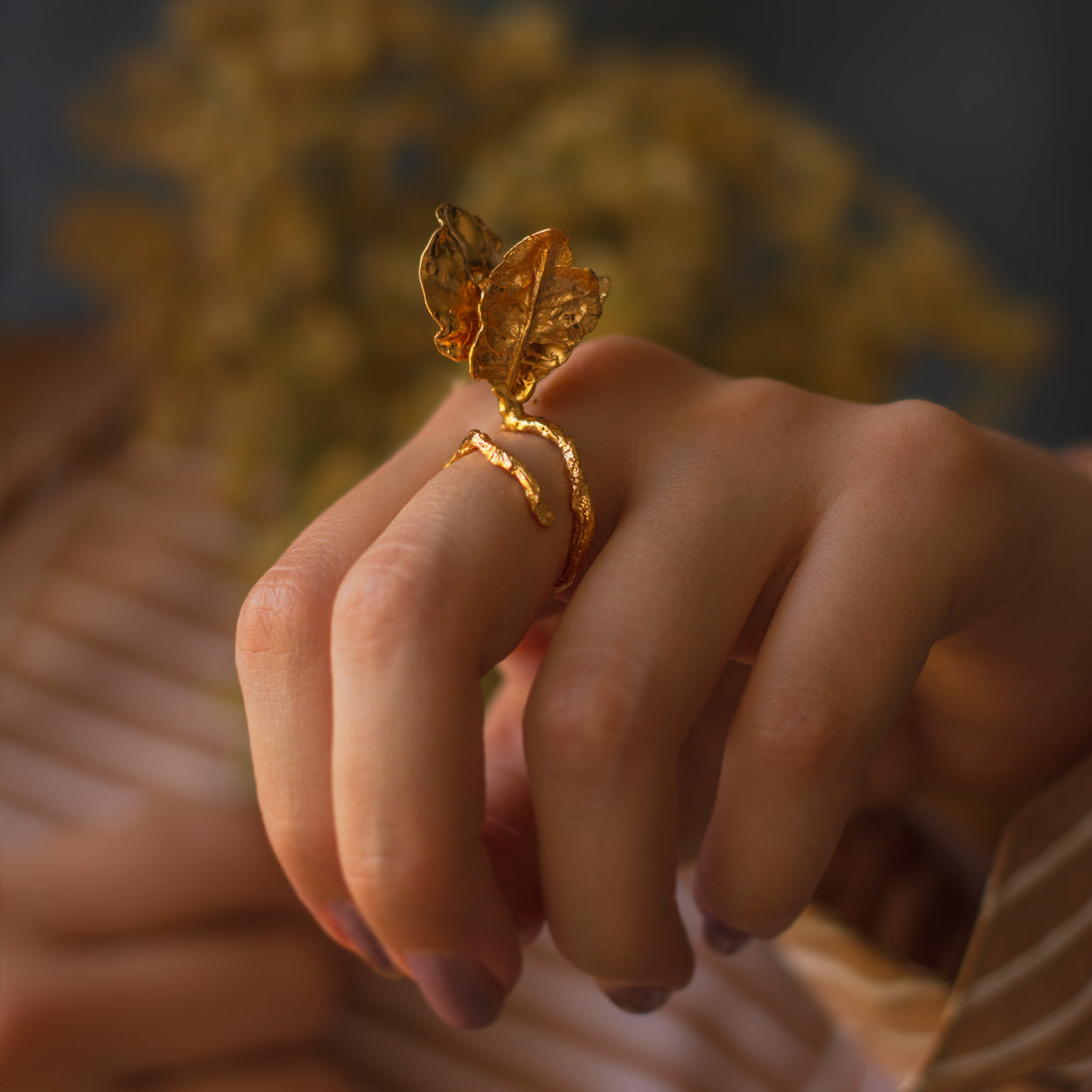 Model wearing Bougainvillea Veranera Ring, illustrating its unique, nature-inspired beauty.
