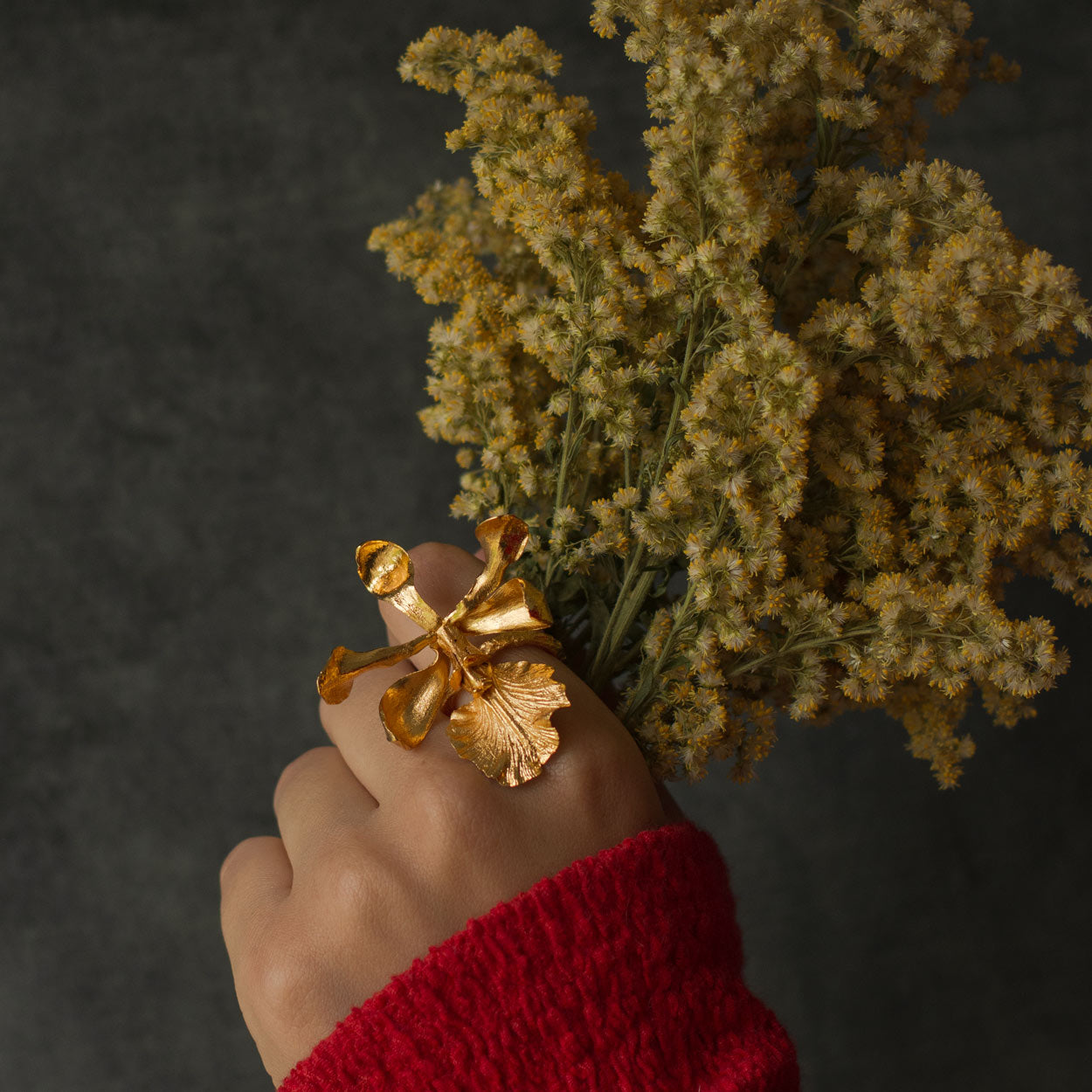 Model wearing Encyclia Cordigera Orchid Ring, illustrating its unique botanical beauty and exclusivity.
