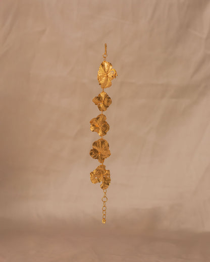 Elegant wrist wearing Five Hydrangea Flower Bracelet, featuring delicate floral design in gold.