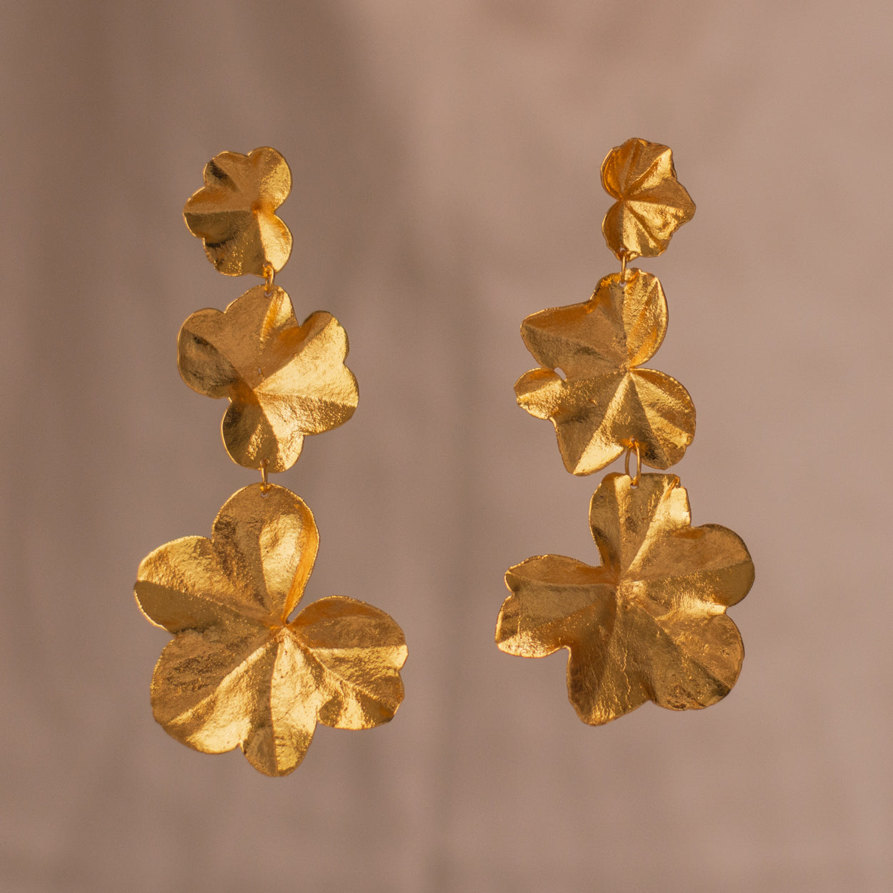 Long Three Ivy Leaf Earrings in bronze with 24k gold plating, showcasing preserved ivy leaves in a cascading design.
