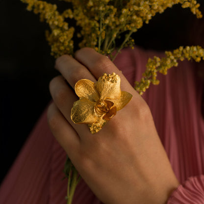 Elegant Phalaenopsis Orchid Elderberry Ring plated in 24K gold, embodying the beauty and strength of femininity.