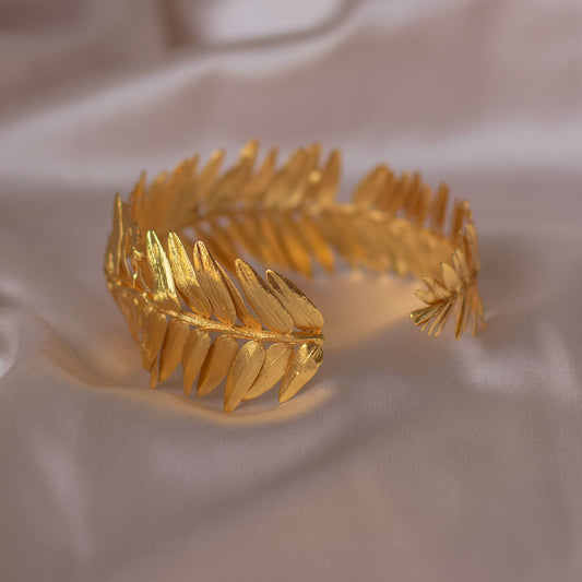 Elegant Roseron Pine Leaf Fern Bracelet in 24K gold plating, capturing the serene beauty of the forest in a luxurious design