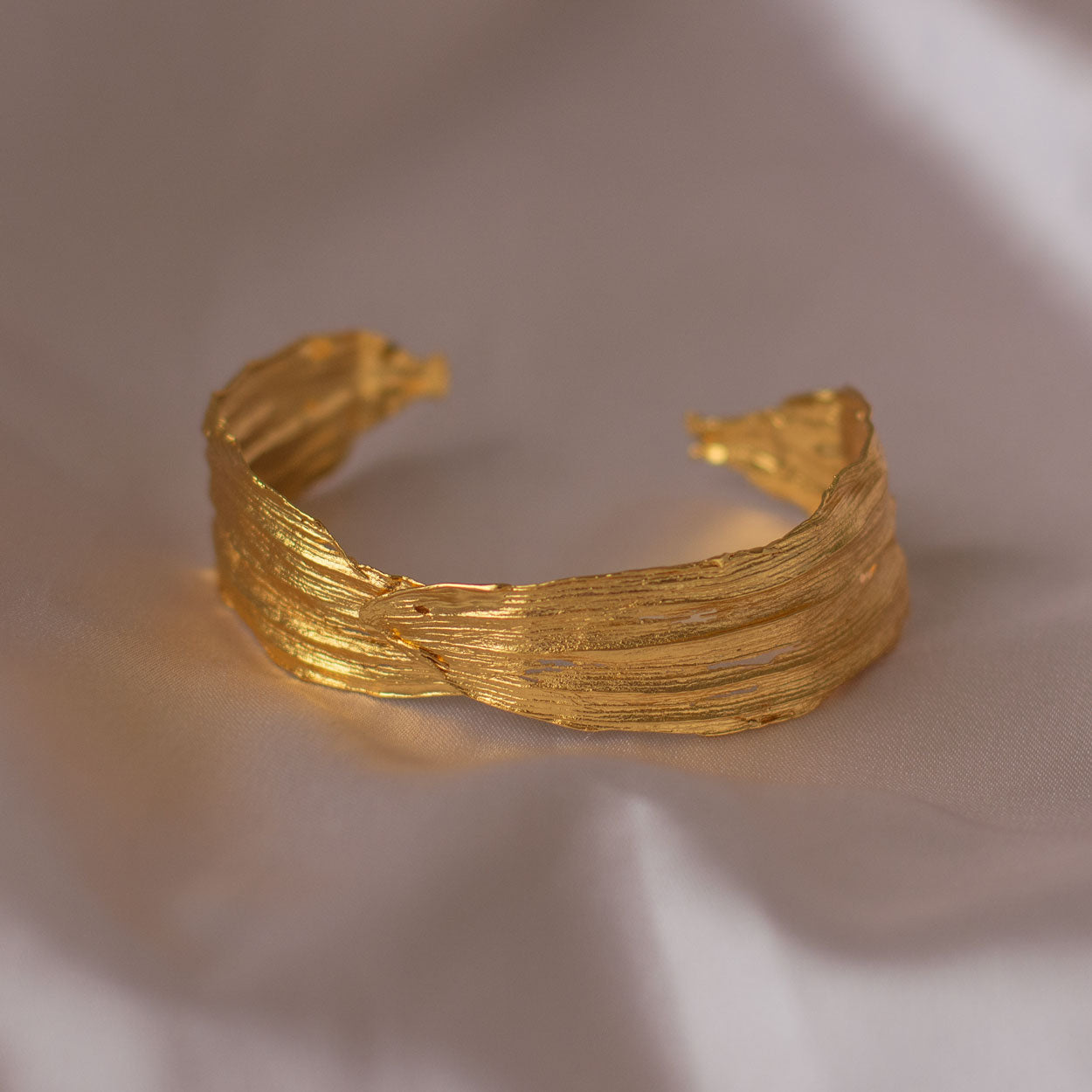 Elegant Cattleya Orchid Leaf Bracelet in 24K gold plating, celebrating the uniqueness of nature and sustainable fashion