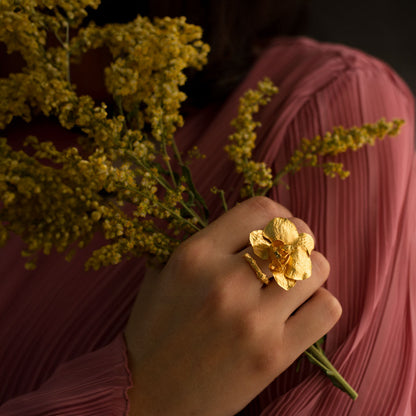 Elegant Phalaenopsis Baby Orchid and Twig Ring in 24K gold plating, symbolizing a deep connection with nature and a commitment to preservation.