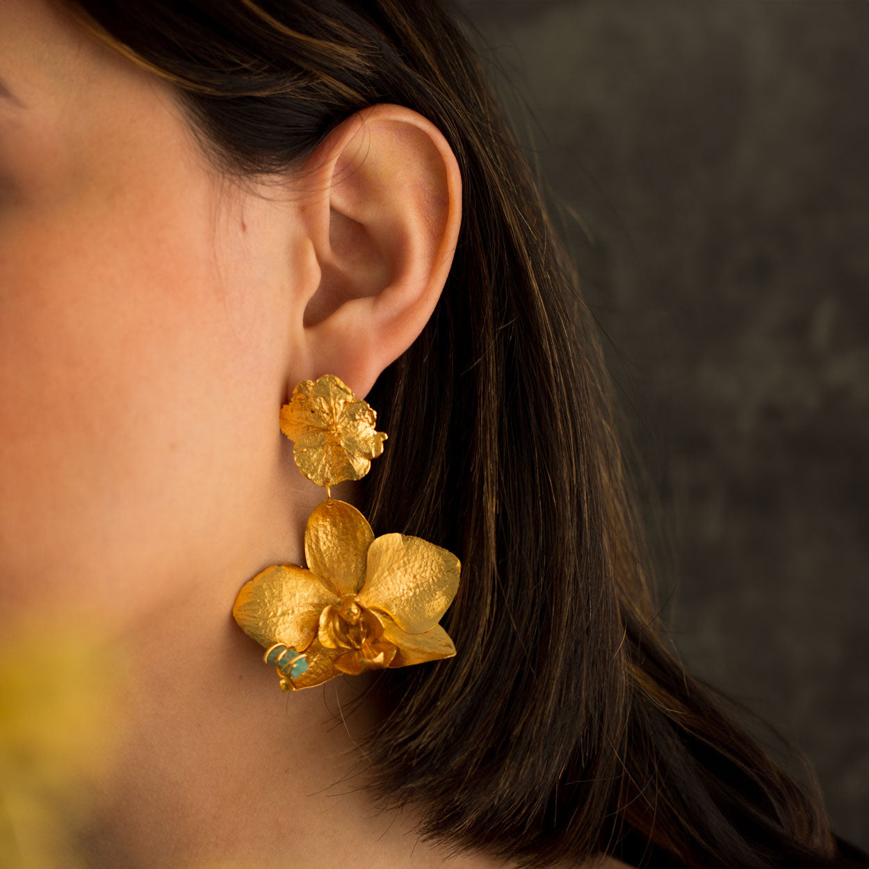 Model wearing Phalaenopsis Orchid Hydrangea Earrings, illustrating the natural beauty and artistic design of these eco-conscious earrings