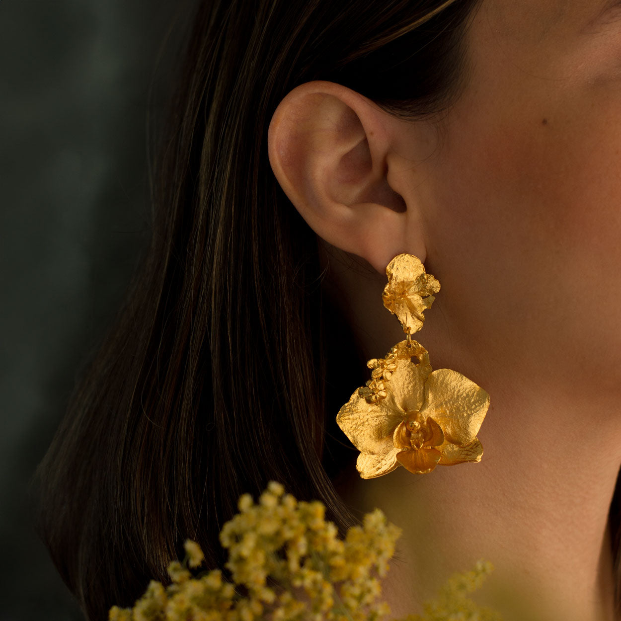 Model wearing Phalaenopsis Orchid Hydrangea Earrings, illustrating the natural beauty and artistic design of these eco-conscious earrings