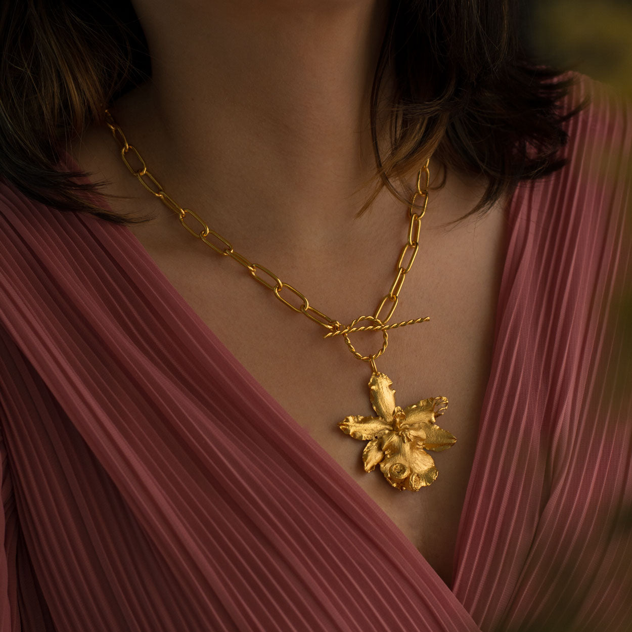 Exclusive Odontoglossum Orchid and Elder Quartz Necklace in 24k Gold Plating, embodying natural sophistication and love for nature.