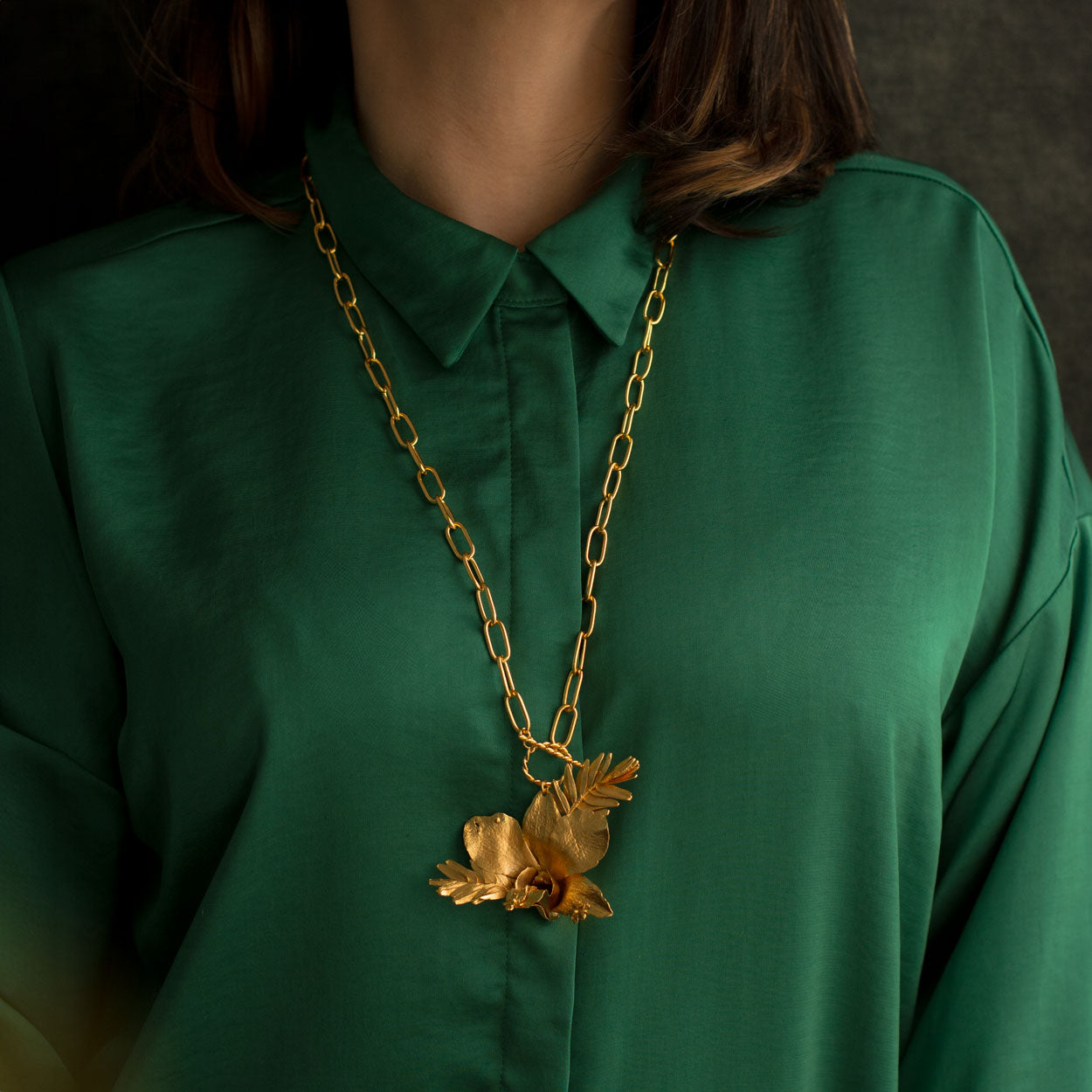 Luxurious Dendrobium Orchid Necklace with gold plating, capturing the exotic elegance of nature in every detail.