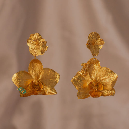 Phalaenopsis Orchid Hydrangea Earrings close-up, showcasing the intricate details of bronze and 24k gold-plated Phalaenopsis orchid and eco-friendly silver hydrangea