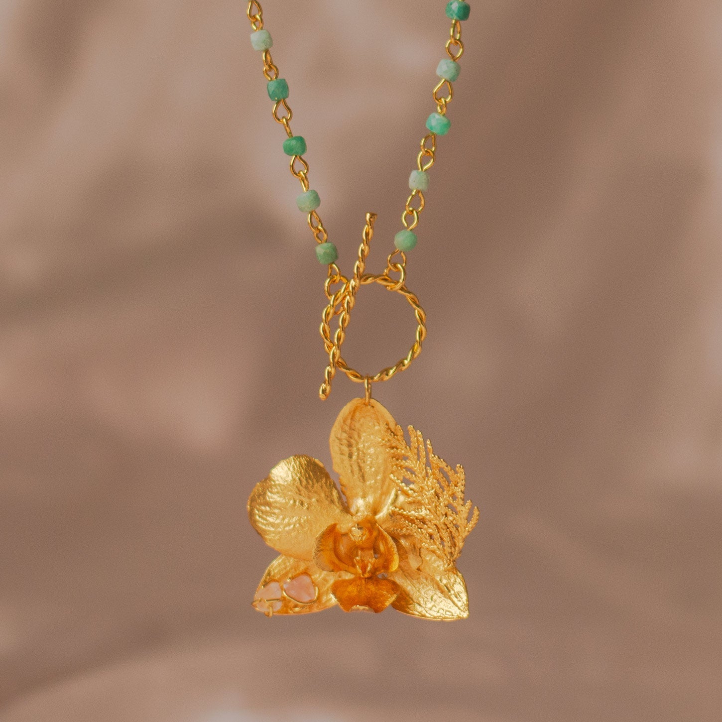 Elegant Aquamarine Phalaenopsis Orchid Necklace in 24K gold plating, featuring a cascade of aquamarine quartz, a tribute to nature's unparalleled beauty