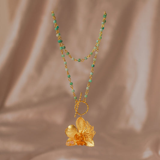 Elegant Aquamarine Phalaenopsis Orchid Necklace in 24K gold plating, featuring a cascade of aquamarine quartz, a tribute to nature's unparalleled beauty