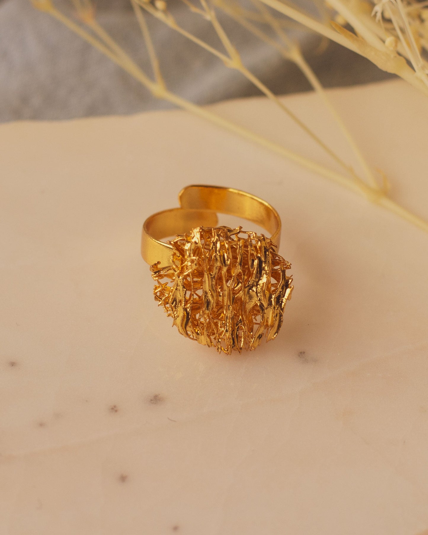 Artisanal Round Luffa Sponge Ring, featuring luffa fibers transformed into a beautiful gold-plated bronze design.