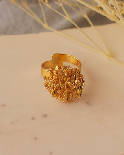 Artisanal Round Luffa Sponge Ring, featuring luffa fibers transformed into a beautiful gold-plated bronze design.