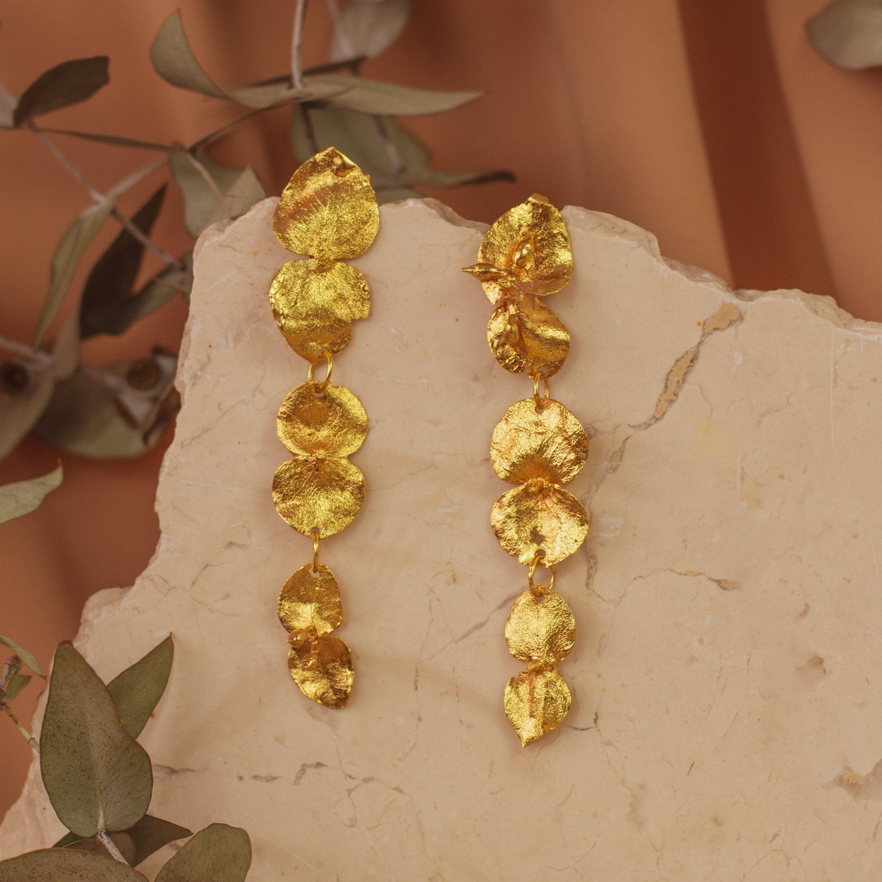 Artisanal Large Eucalyptus Earrings, gold-plated, capturing the essence of natural beauty with three finely detailed leaves