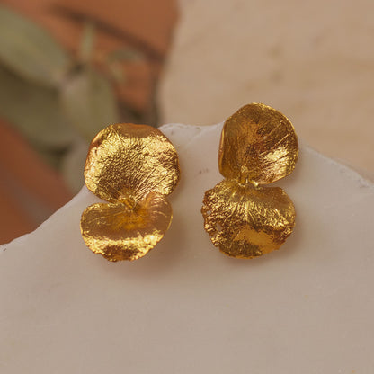 Delicate Eucalyptus Leaf Stud Earrings in 24K gold plating, embodying the freshness and serenity of nature in a sophisticated design