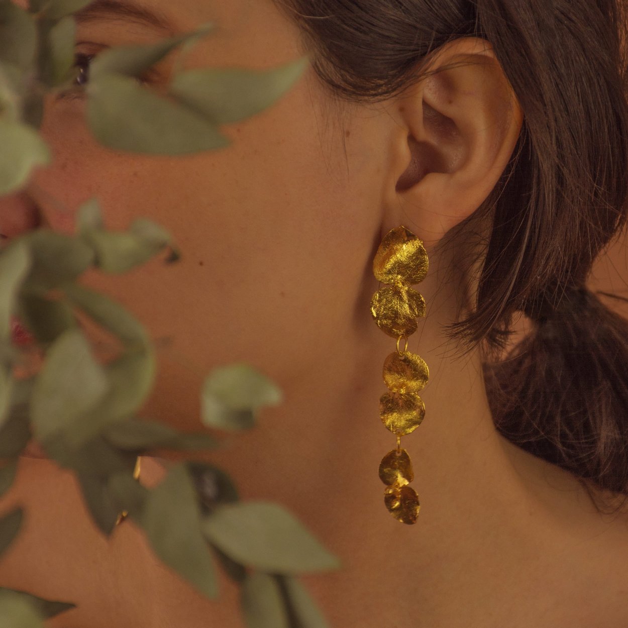 Unique Large Eucalyptus Leaf Earrings, made from bronze and plated with 24k gold, showcasing the fresh and vibrant design of eucalyptus