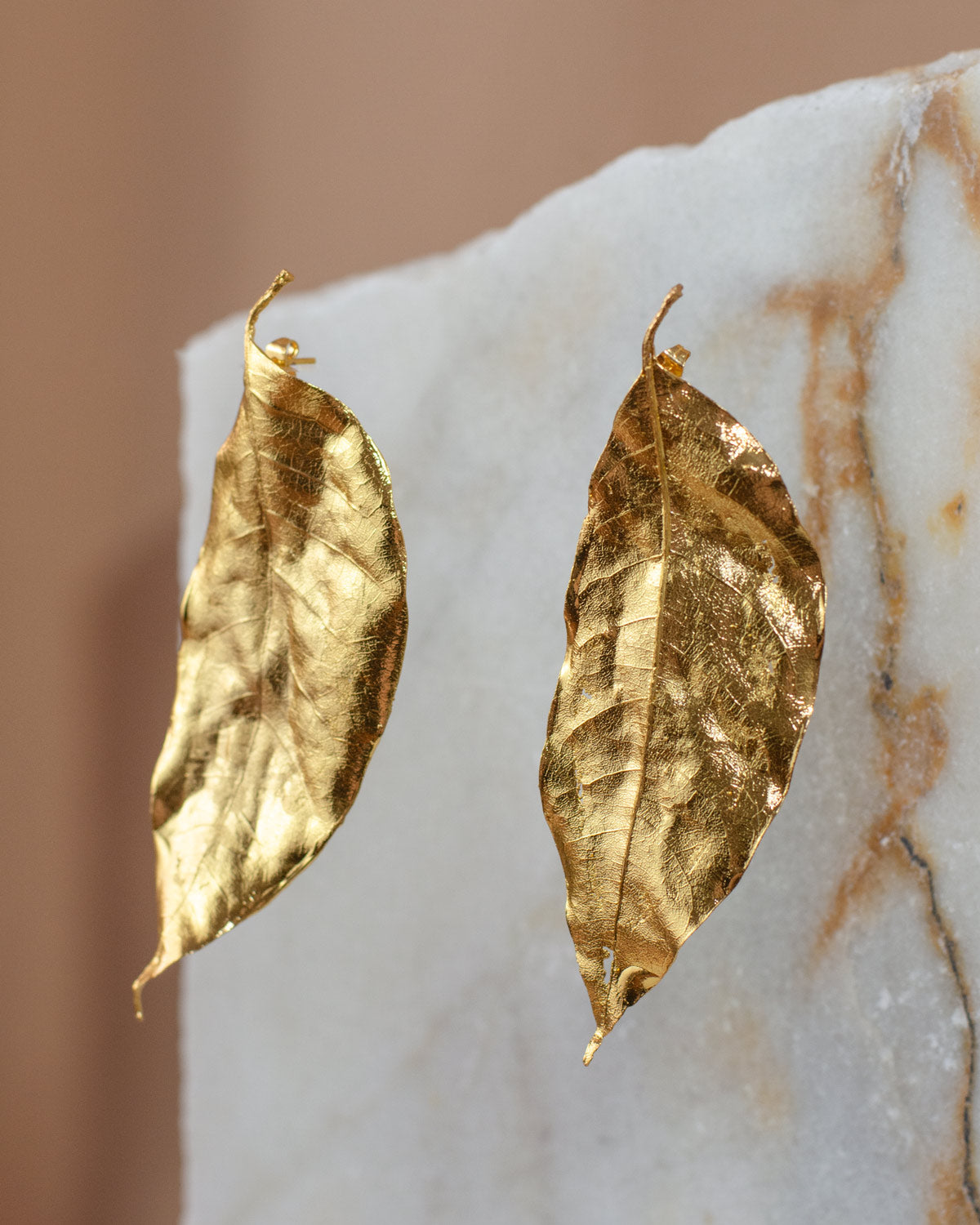 Elegant Cúcuta Leaf Stud Earrings in 24K gold plating, a meaningful accessory that captures the beauty and spirit of Cúcuta