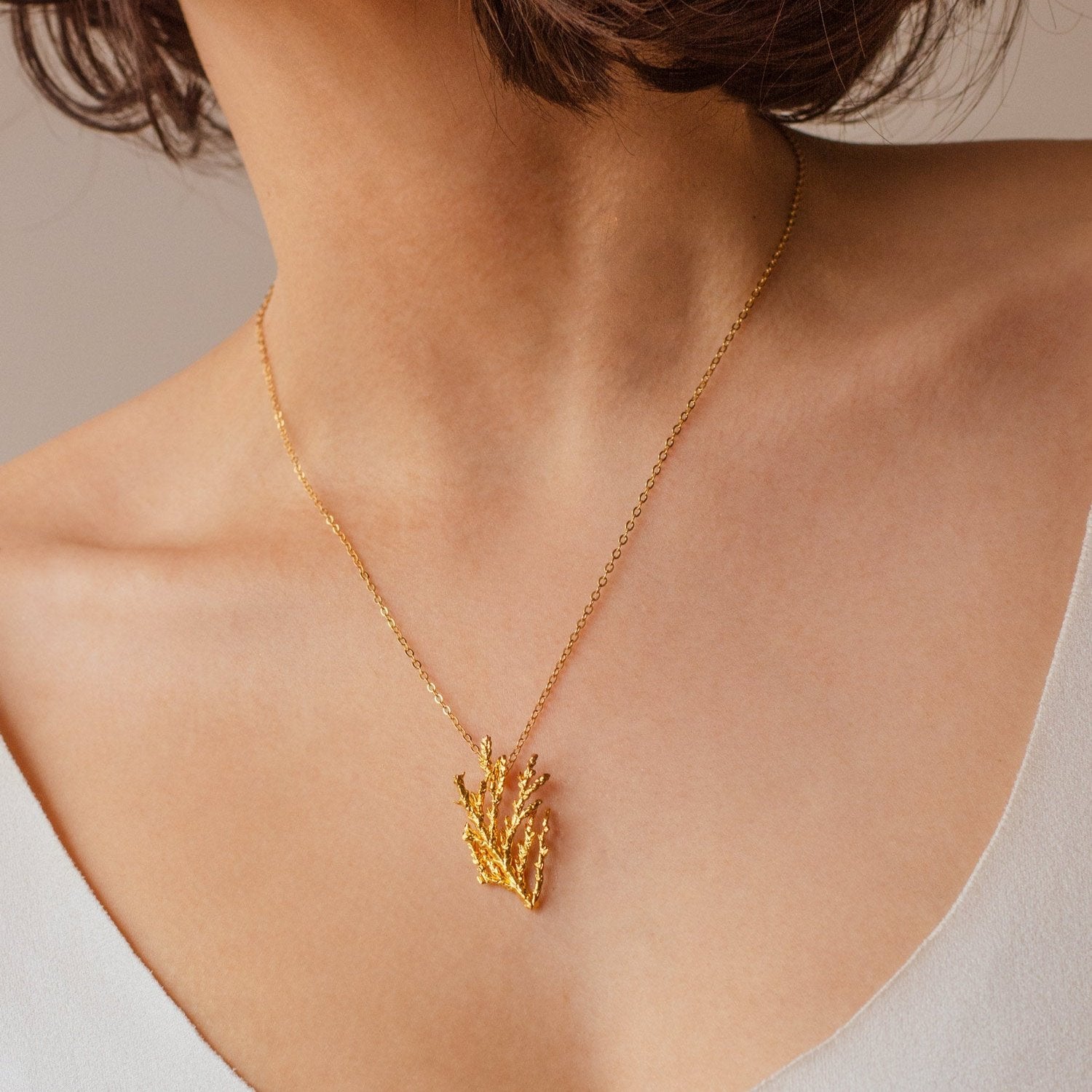 Artisanal Pine Leaf Choker, gold-plated, capturing the essence of nature with an elegant and sophisticated design