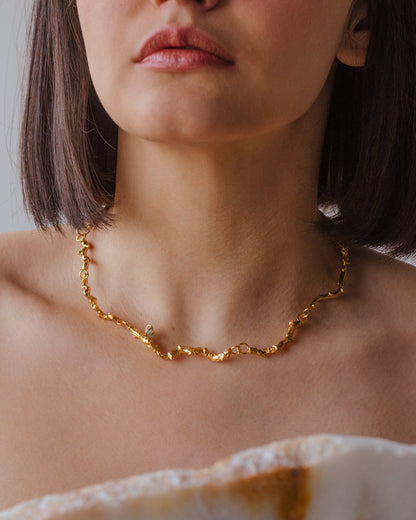 Elegant Coconut Palm Twig Emerald Choker in 24K gold plating, adorned with Colombian emerald chips, embodying the love for nature and artisanal design