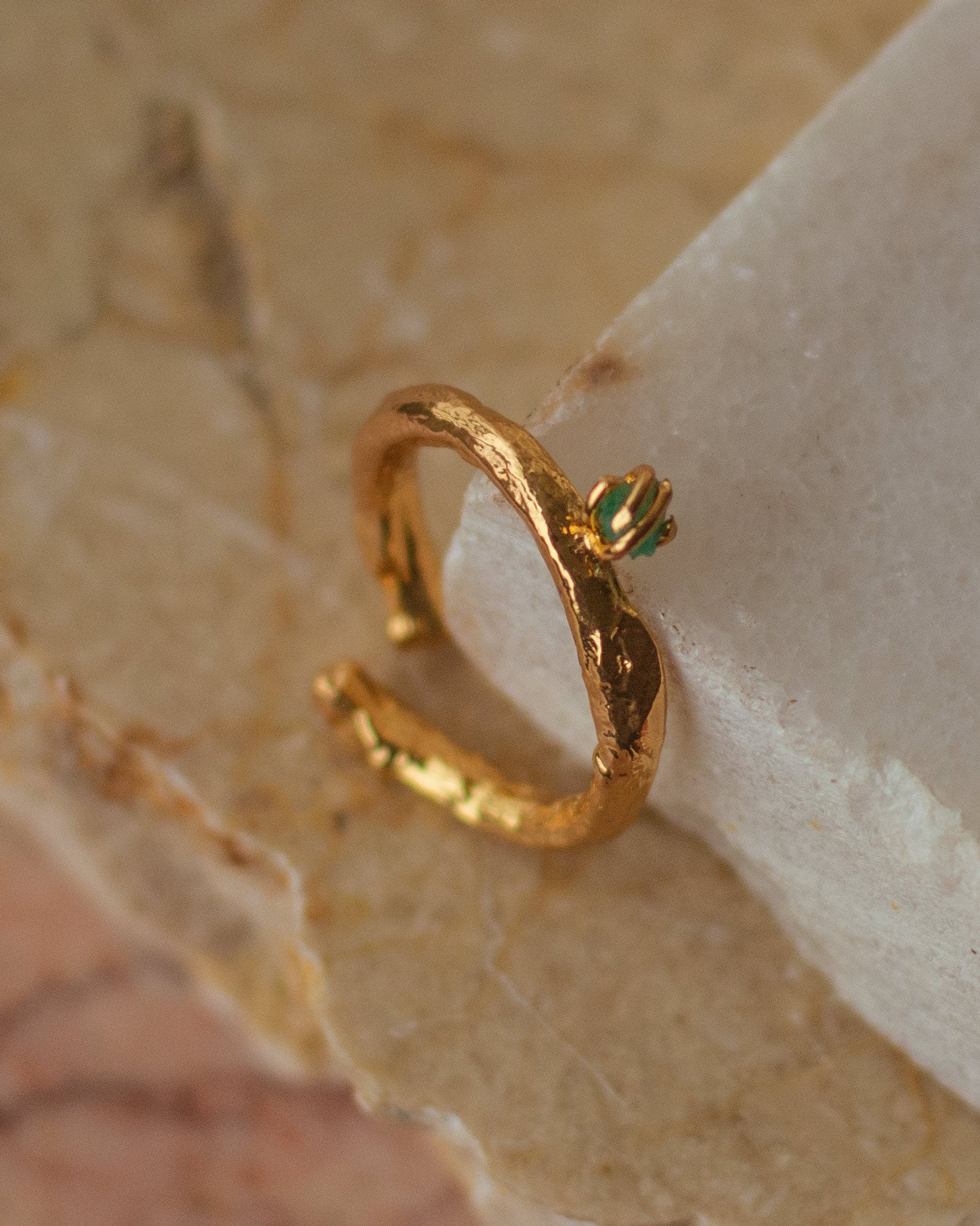 Elegant Twig Ring with Colombian Raw Emerald in 24K gold plating, a unique artisanal piece that captures the spirit of nature and the luxury of precious stones