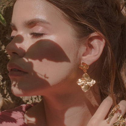 Model wearing Two Hydrangea Earrings, highlighting the natural beauty and unique design.
