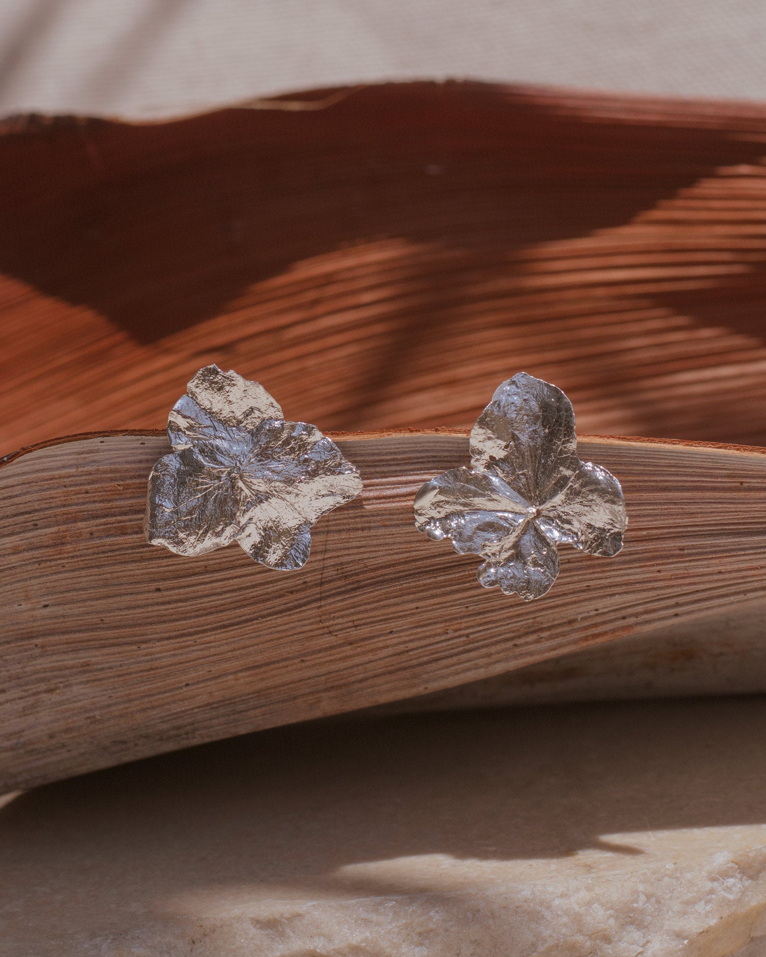 Unique Eco-Friendly Silver Hydrangea Stud Earrings, capturing the delicate beauty and intricate story of each hydrangea