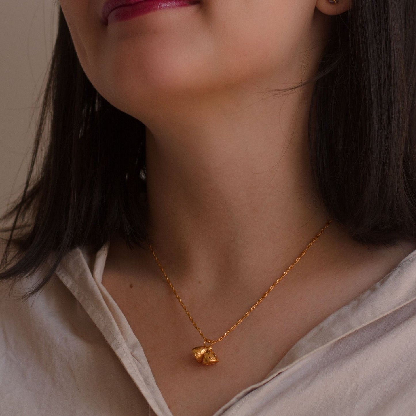 Unique Eucalyptus Seed Choker, made from bronze and plated with 24k gold, showcasing delicate eucalyptus seed craftsmanship