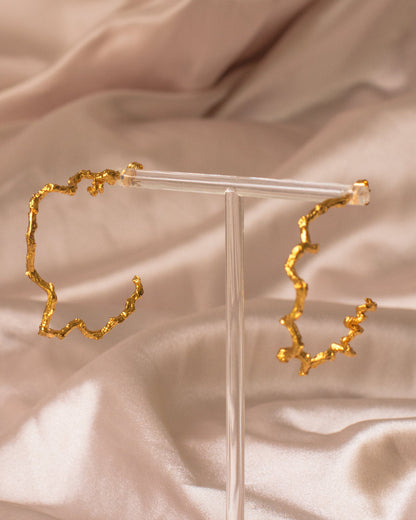 Elegant Large Palm Twig Hoop Earrings in 24K gold plating, celebrating the creativity of nature and artisanal craftsmanship.