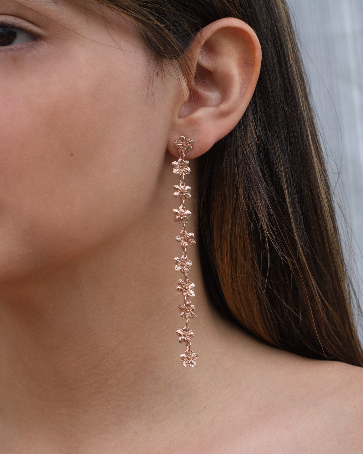 Close-up of Large Elderflower Earrings showcasing the intricate details of the elderflowers preserved in bronze and plated with 24k gold