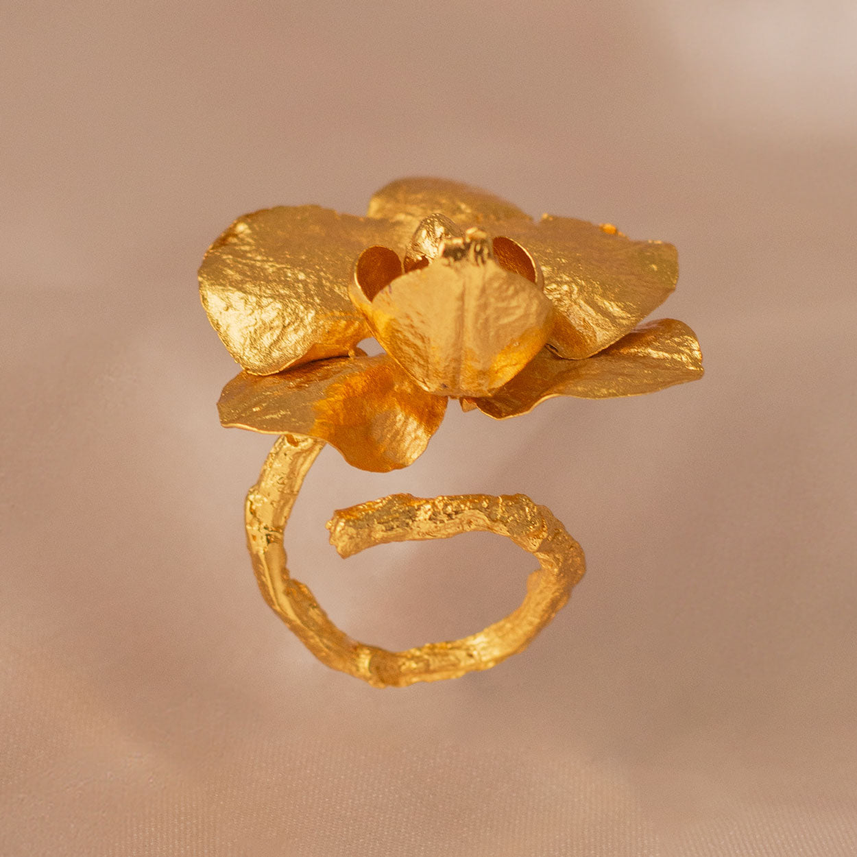 Elegant Phalaenopsis Baby Orchid and Twig Ring in 24K gold plating, symbolizing a deep connection with nature and a commitment to preservation.