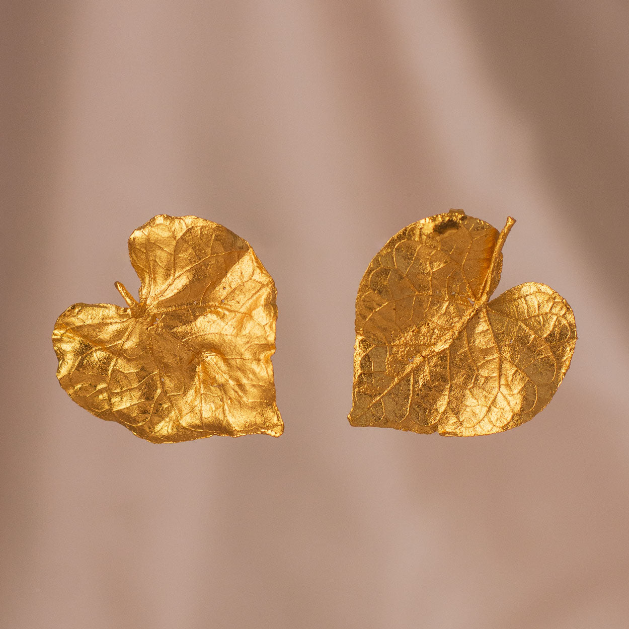 Elegant Heart Leaf Stud Earrings in 24K gold plating, a unique blend of natural beauty and the symbol of love, preserved forever