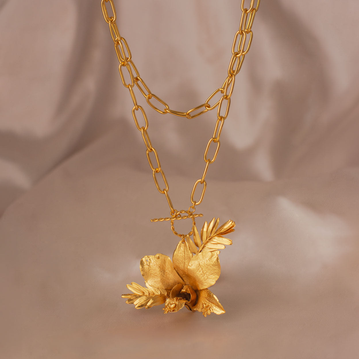 Luxurious Dendrobium Orchid Necklace with gold plating, capturing the exotic elegance of nature in every detail.